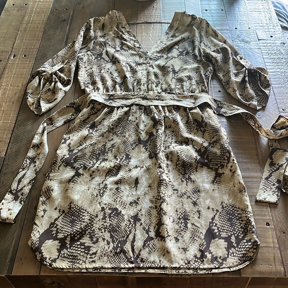 Women’s dress - excellent condition - small, animal print w/pockets & wrap tie